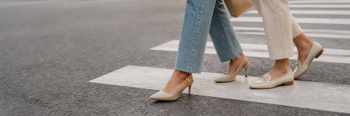 Women wearing Vutoria shoes on a crosswalk